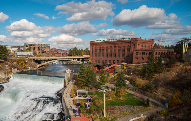 An image of Spokane featuring some buildings and their waterfall